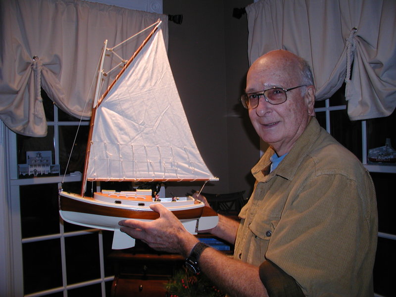 Walt Crafts displays a model similar to the 20-foot catboat he sails. Crafts learned to sail when he was 11. He worked a variety of jobs, including one writing computer programs for a rocket scientist. BY HENRY J. EVANS JR.